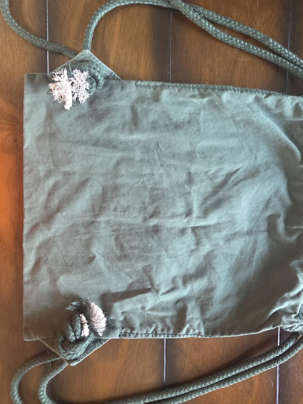Champion Green Bay drawstring bag features olive green canvas